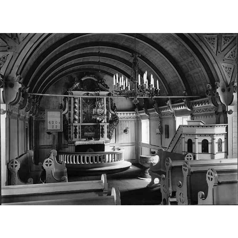 Source caption: "Tångeråsa kyrka [...] Interiör mot öster." -- showing the medieval stone font in it, by the foot of the pulpit stairs