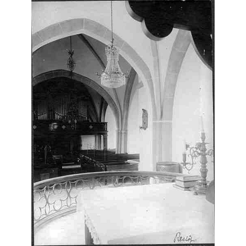 Source caption: "Reslövs kyrka [...] Interiör mot väster." -- the font is partially visible inside the chancel, on the right side of the image