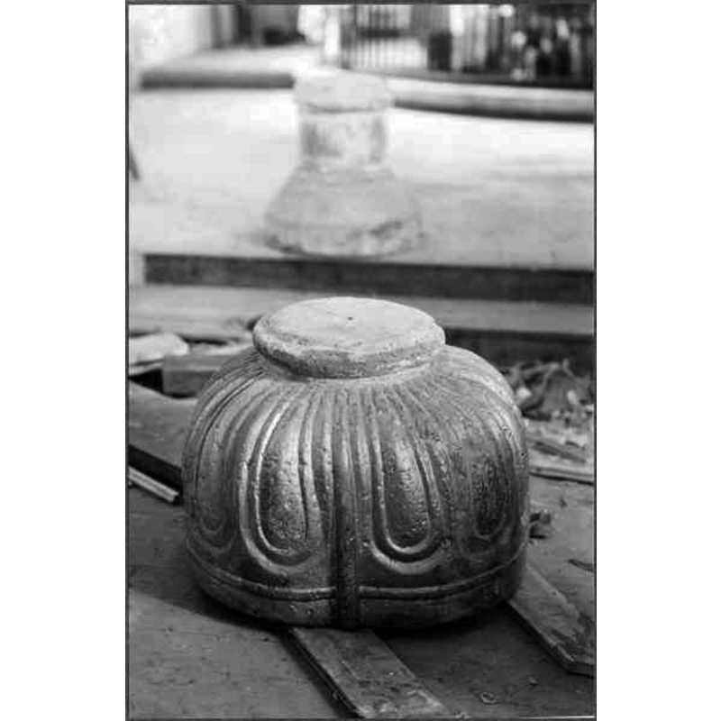 Source caption: "Visseltofta kyrka [...] Dopfunt, huggen i två block. Svagt fyrklöverformad, funten helt överdragen med silverbrons." -- showing the upturned basin in the foregrounf, the pedestal base behind; this view of the basin shows better its quatrefoiled shape; notice also that the pedestal base is different from the 1926 photograph [ImageFileNo. 0210822003], but it appears complete in the ca. 2003 SHM photograph [ImageFileNo.1210822008] -- Tynell (1913-1921) notes that the lower base [27 cm] was at the time buried under the chancel flooring