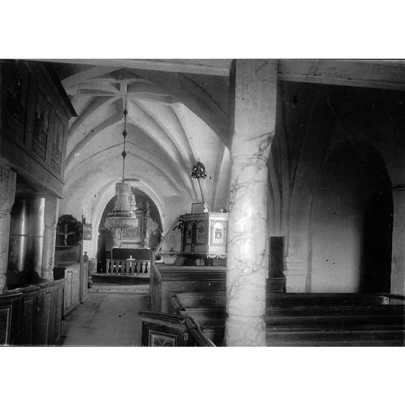 Source caption: "Vitaby kyrka [...] Kyrkan mot öster." -- partially showing the medieval font at the far [east] end, by the left [north] pillar of the chancel arch