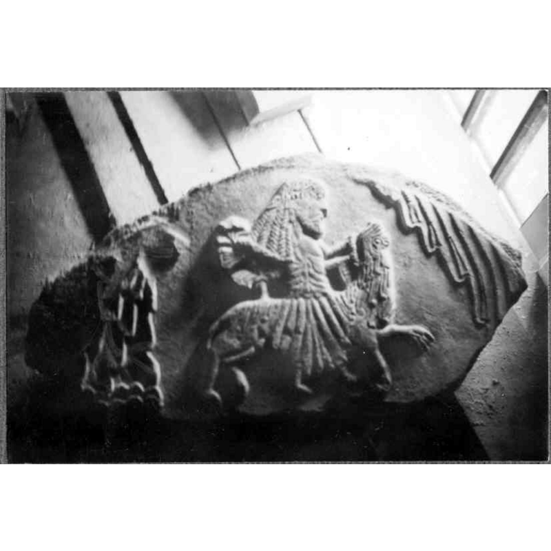 Source caption: "Östra Sallerups kyrka [...] Romanskt tympanon i rengjort skick." -- showing the fragment of a former tympanum that was found built into an interior wall; seen here after its removal and cleaning