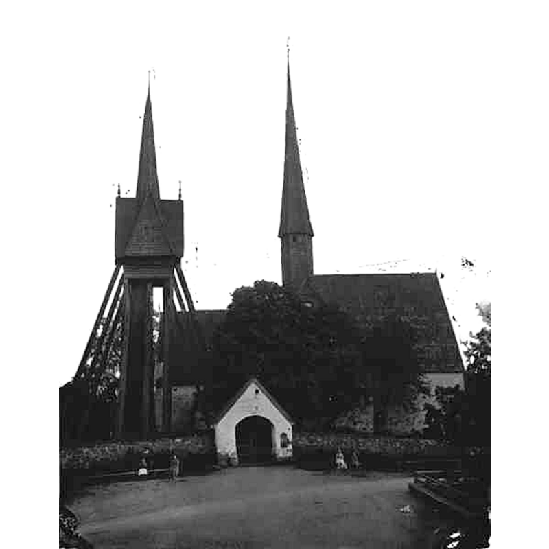 Source caption: "Dalhems gamla kyrka [...] Kyrkan mot norr, klockstapel." -- showing the old church in 1875, one year before its demolition in 1876; the new church would be consecrated in 1878