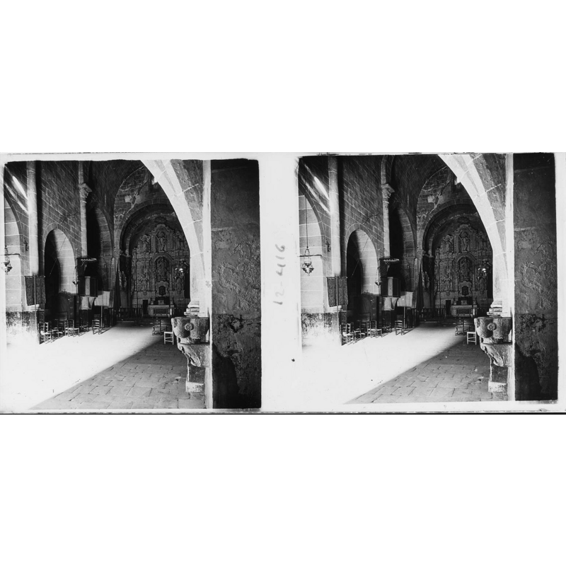 Source caption: "Vista interior de l'església de Sant Miquel de Fluvià. Josep Salvany i Blanch (1917)" -- notice the wall-mounted holy-water stoup on the right wall