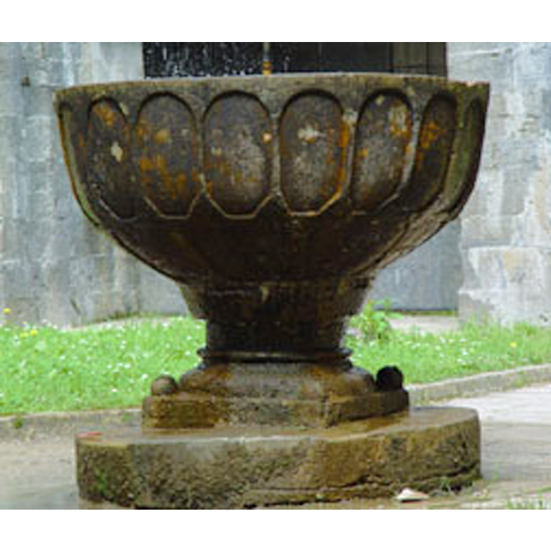 the font already in its new location, in the Colegiata of Roncesvalles, now serving as garden ornament