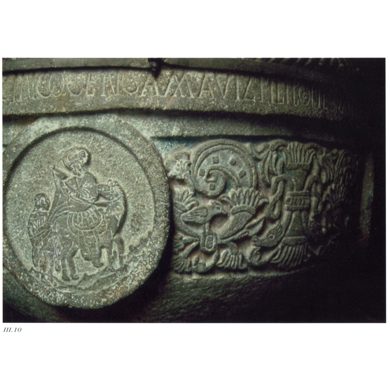 in one of the four medallions ornamenting the sides -- [Romero Quiroz and Reyes-Valerio describe it as the Flight to Egypt -- Cosentino argues that it is St. Martin instead]