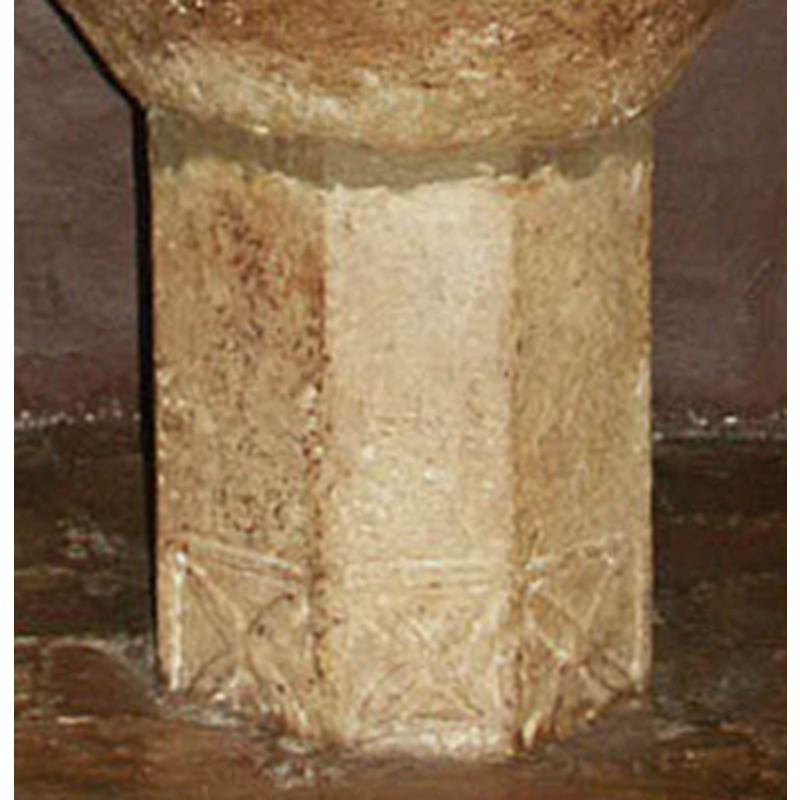 one on each side of the lower end of the polygonal stem