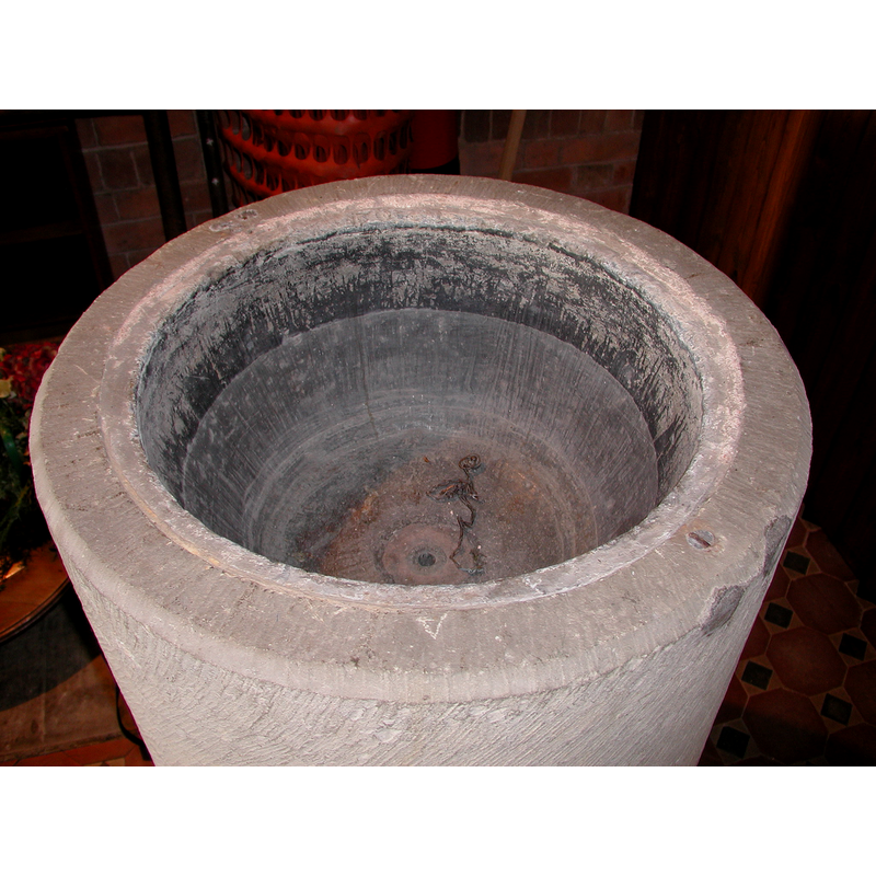 note the metal staples of the old font in the upper rim