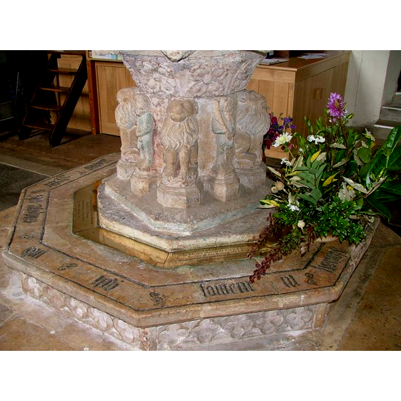 one at each angle of the square pedestal base, on a ledge or platform