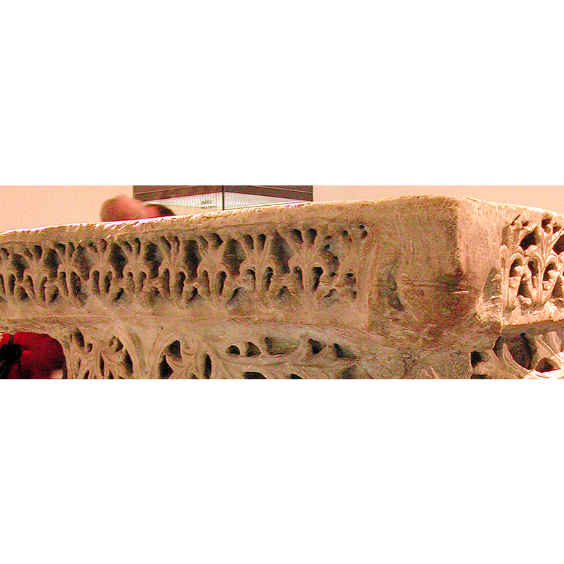 stylised and deeply carved, on the sides of the abacus