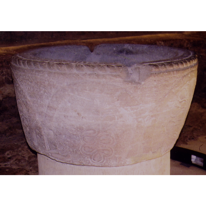 parallel to the rope moulding above  [notice the damaged rim at opposite sides, probably where the staples of the old cover were forcibly removed]