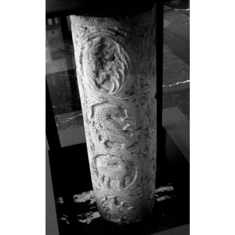 probably lions, eagles, etc., in the foliage circles down the stem of the base