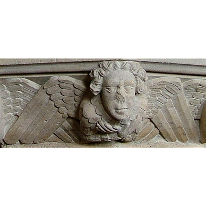 at the angles of the underbowl, alternating with winged hearts