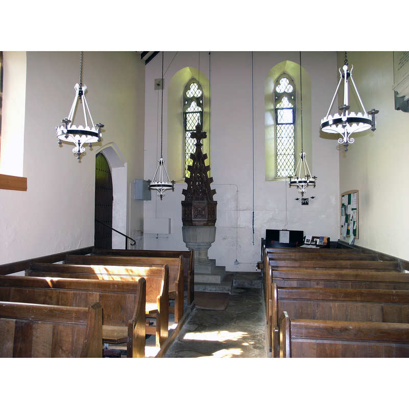 the mid-19thC replacement font and cover; the fragment of the old font is at the other end of the church, beside the lectern