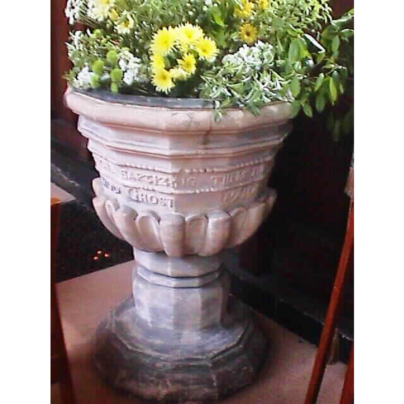 the 18th-century font in the Abbey