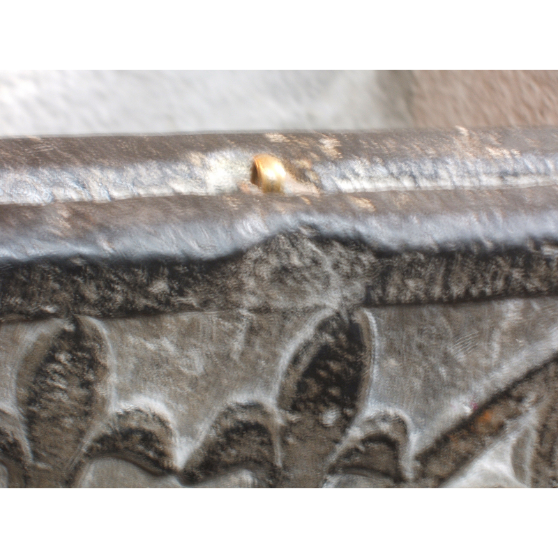 West side of the basin: detail of the upper rim: a brass (?) staple for the cover; probably not original