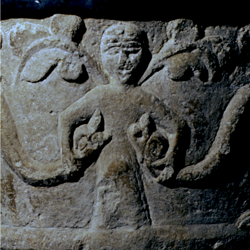 the human figure holding the heads of the two beasts: Luxuria?
