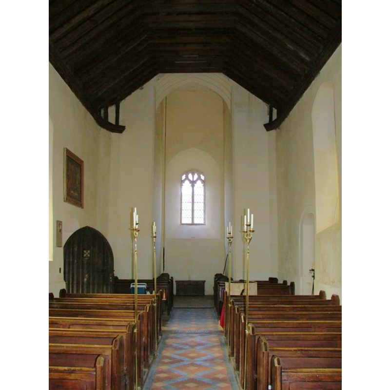 the top of the font visible among the benches on the right-hand (north) side