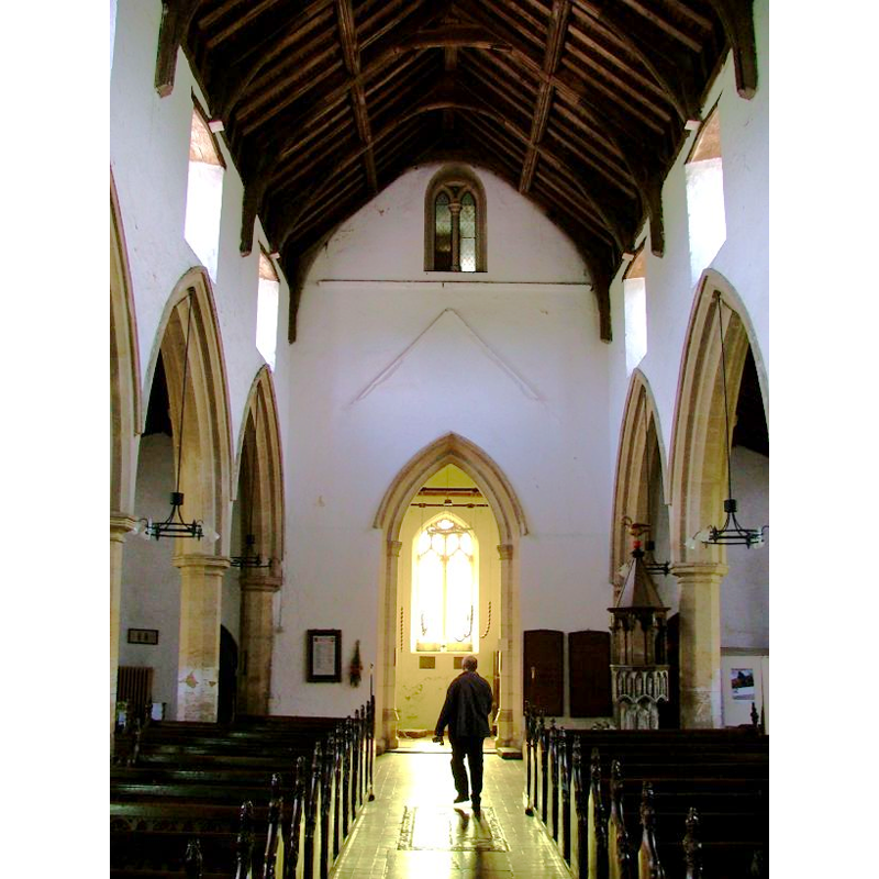 the font and cover on the right side, to the north of the west doorway