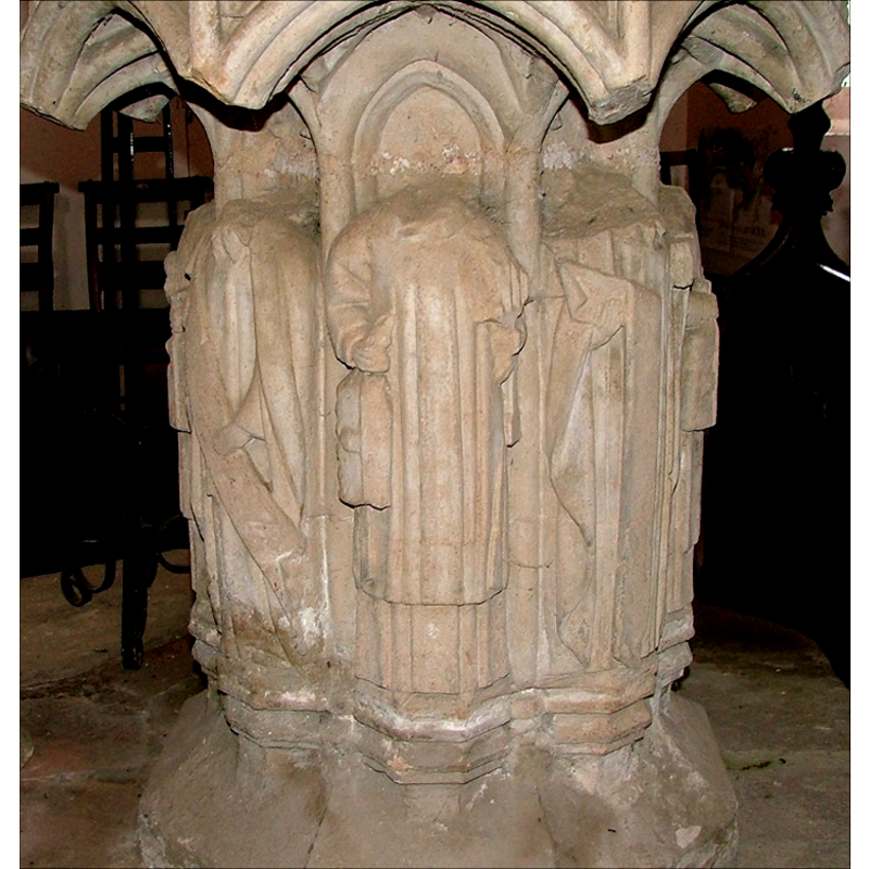 one on each side of the pedestal base; each holding an object, a scroll or a symbol; all wearing church vestments and all decapitated]