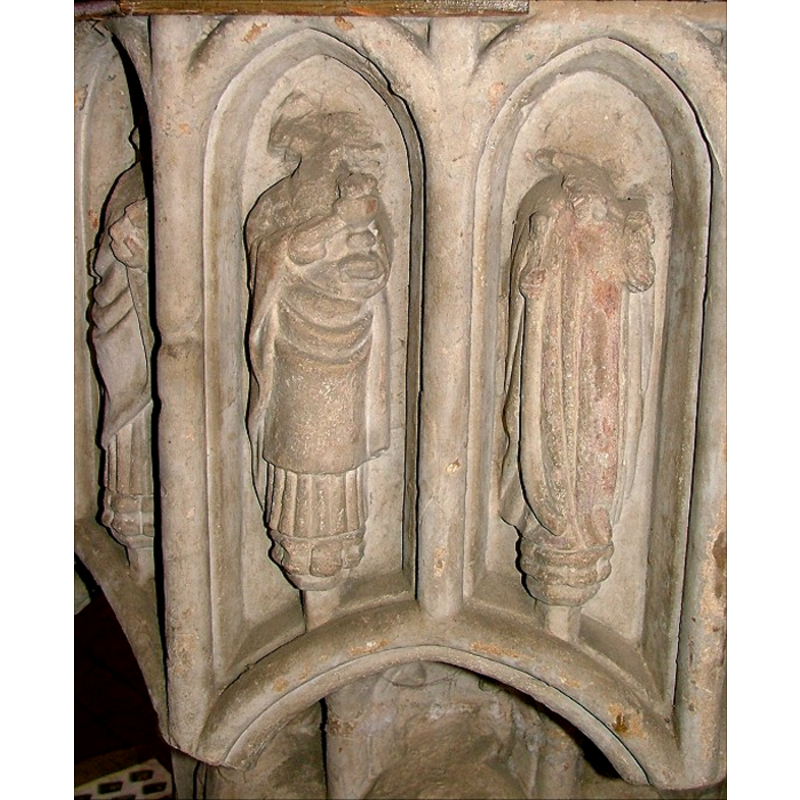 each contains a standing figure; the figure on the right appears to have traces of original (?) paint on it still
