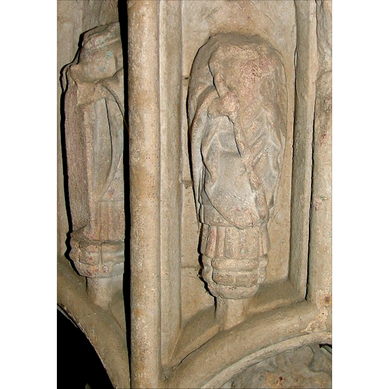 two of the apostles or saints; they appear to have traces of bluish paint on their garments