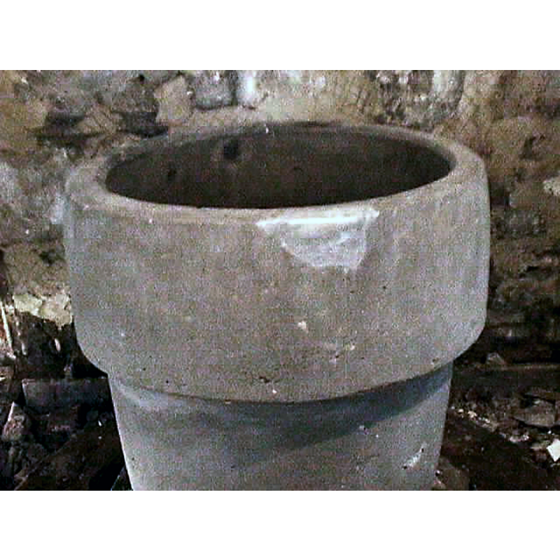 the patched upper rim and the marks on the opposite side are probably evidence of an old font cover