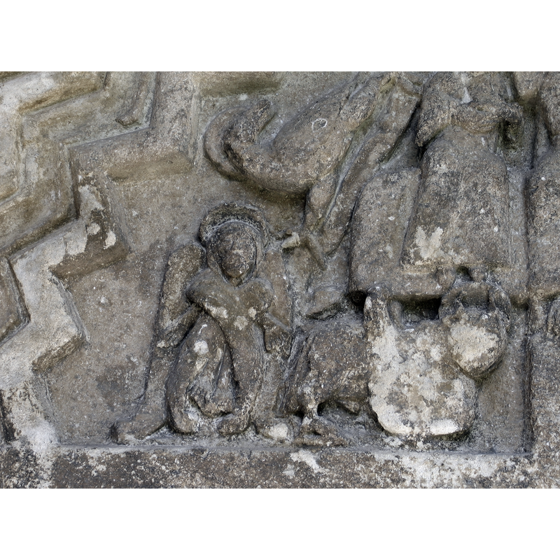 angel located on the bottom left corner of the tympanum, below John's eagle and to the left of Like' winged ox