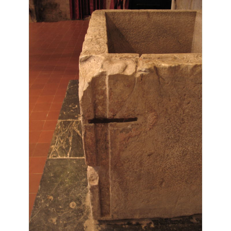 the right side, showing the repair, the vertical groove and the damage to the upper corner
