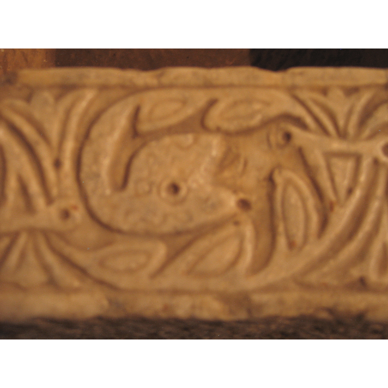 stylised serpent at the end of a vine