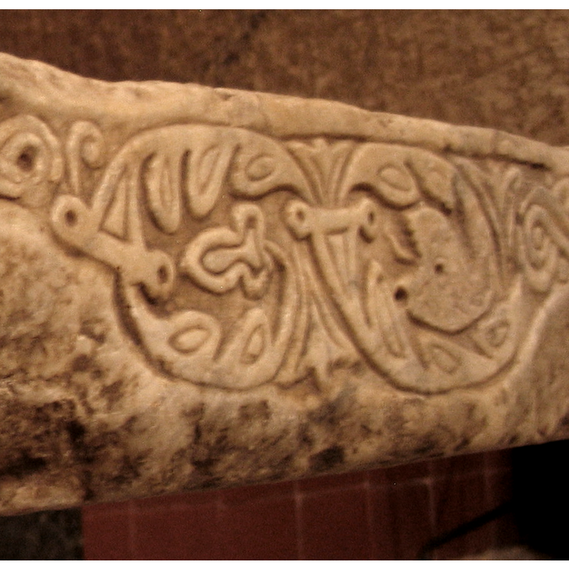 a differently shaped one, with serpent-head endings