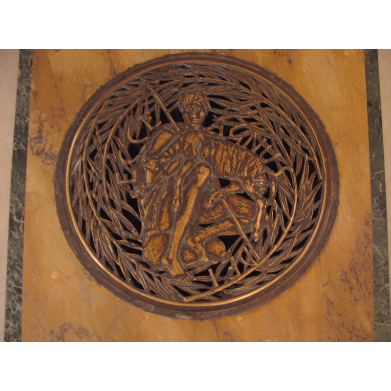 one of the brass plates decorated with baptismal symbols