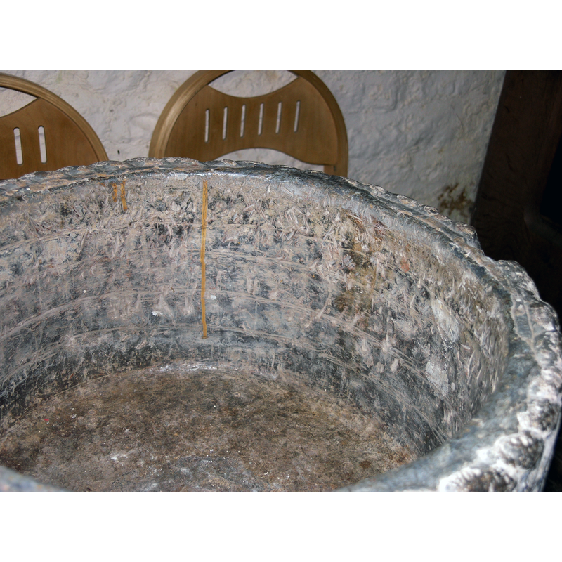 the old lead lining and the damaged upper rim