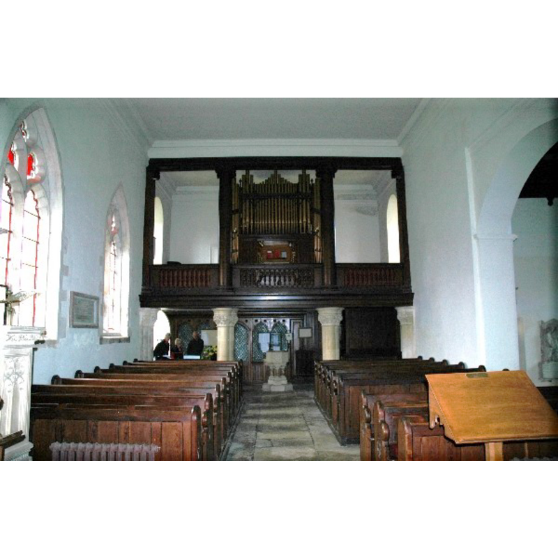 the Victorian font at the west end of the nave, under the gallery