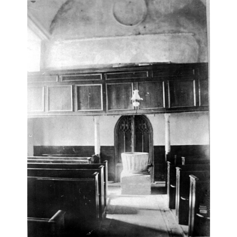 the font in the context of the west gallery in a pre-1900 B&W photograph