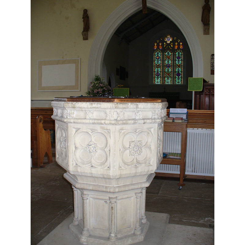 this 19th-century octagonal font was in place inside the church in June 2008 [we have no information on its present whereabouts]