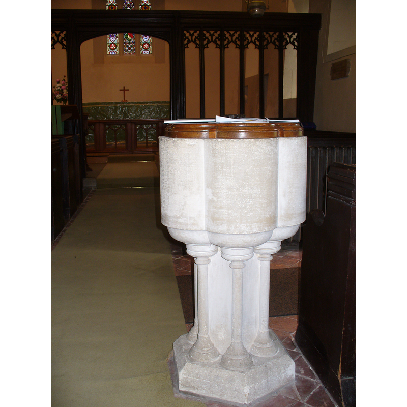 Source caption: "St Bartholomew, [modern] Font. At the west end of this tiny Norman church in Wanborough. The church lies within a former Cistercian grange related to Waverley Abbey."