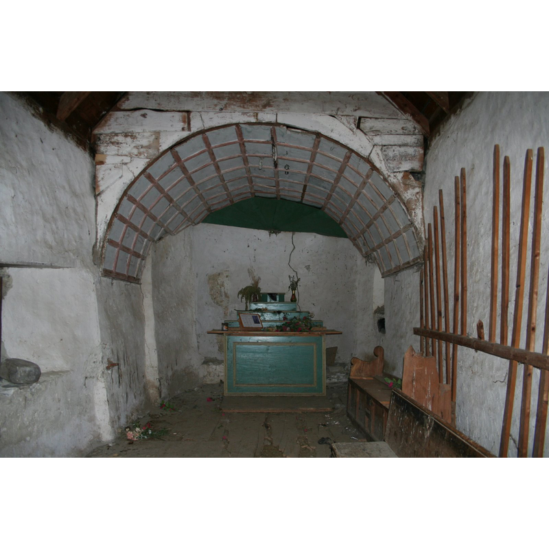 the stoup on the left wall