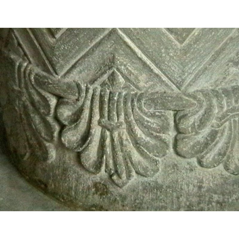 a row of palmettes hanging from a moulding