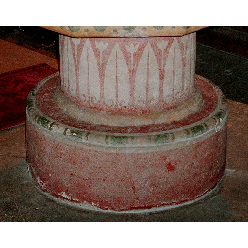 floral and foliage motifs painted on the stem of the base
