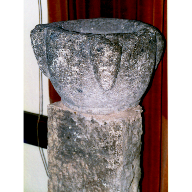 a holy-water stoup inside the church