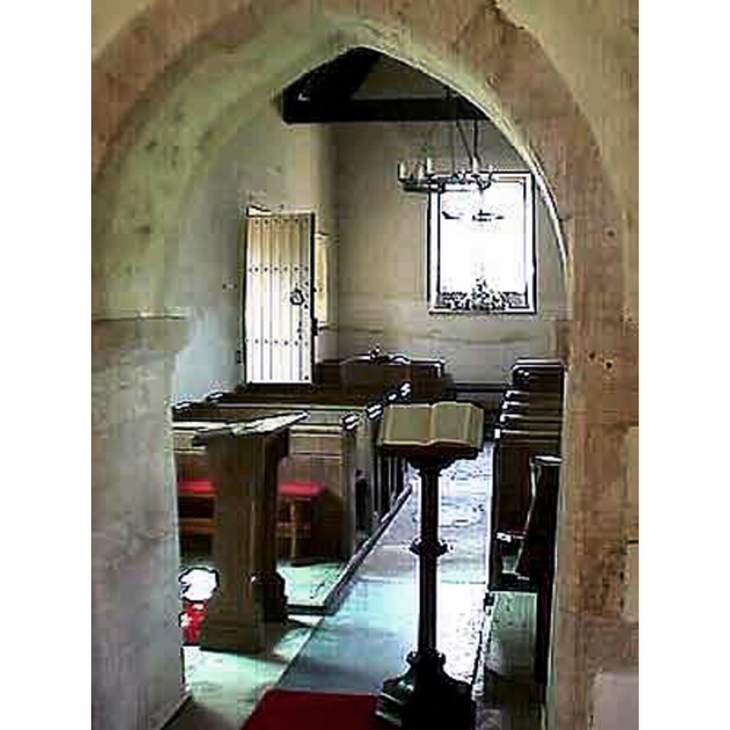 at the west end of the nave, by the south door