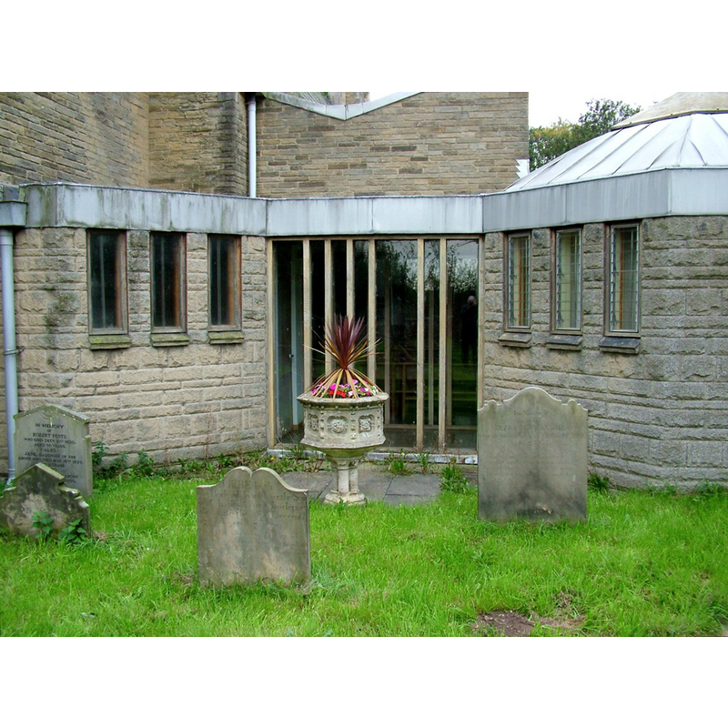 the Victorian font used as a planter in the churchyard [cf. Font notes]