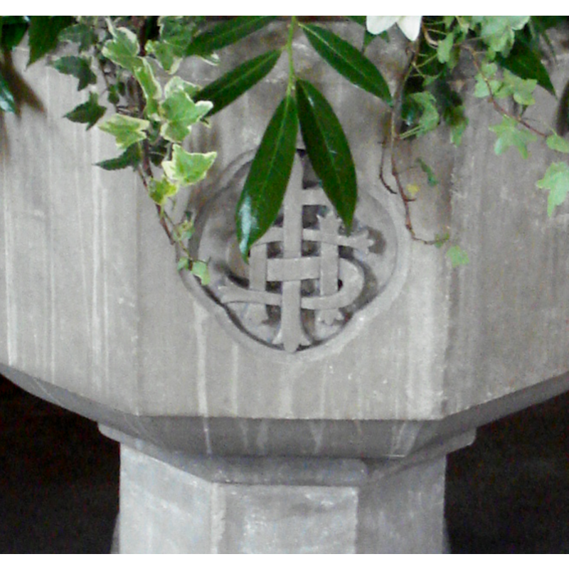 the IHS emblem on the side of the modern font