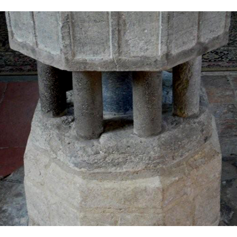 it is not clear how much of the base is original; some of the outer colonnettes are definiely moder replacements, and the central shaft may be not the original either; the lower base on which the columns rest appears original; the volume below is modern