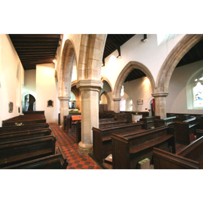 the top of the font visible under the second arch on the north arcade