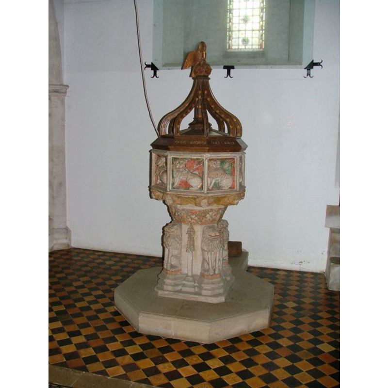beneath the tower: the rope hanging by the side of the font is from the bells