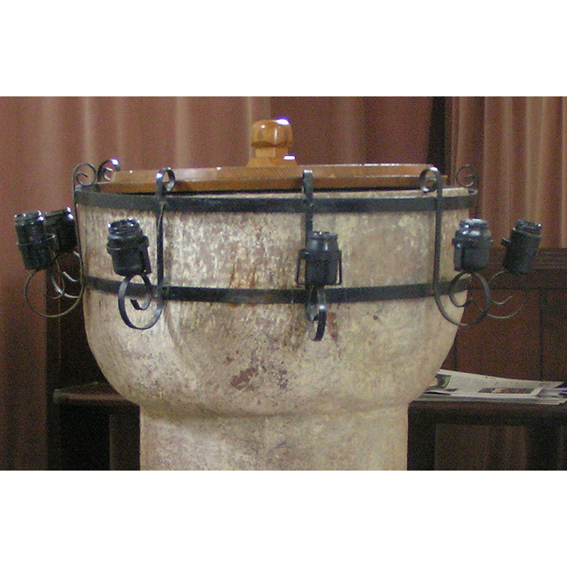 note the metal contraption to hold candles [cf. Font notes]