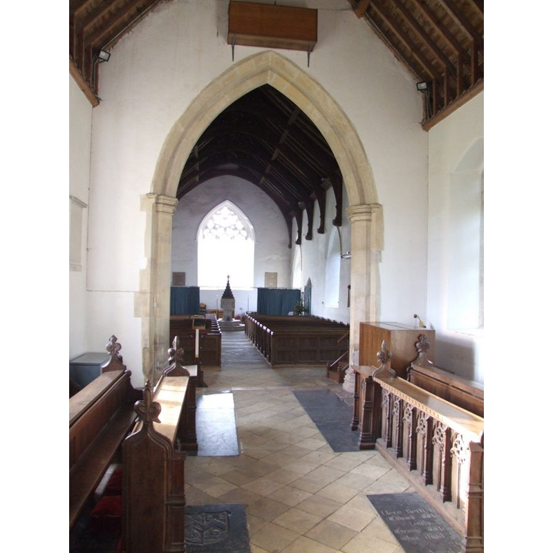 the font and cover at the west end of the nave