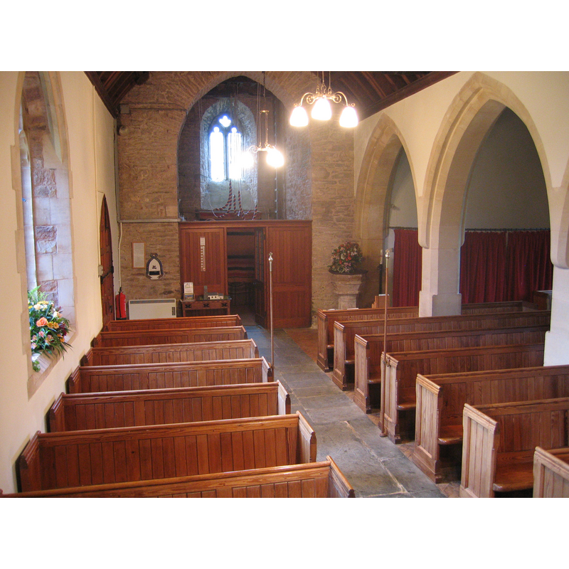 the font on the north side of the south aisle, at the west end of the nave