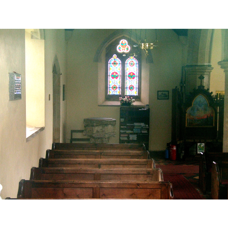 the remains of the font at the west end of the nave, on the south side